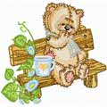 Teddy Bear on the bench in the garden machine embroidery design