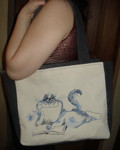 small embroidered bag with funny cat design