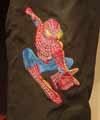 jeans with spiderman embroidery